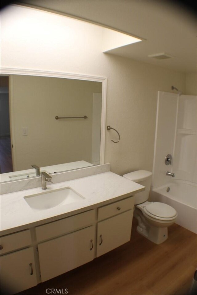 44406 15th St E Unit 13, Lancaster, CA 93535 - bathroom featuring wood finished floors, vanity, and shower / bath combination