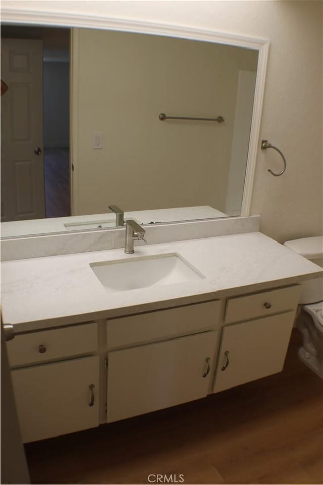 44406 15th St E Unit 13, Lancaster, CA 93535 - half bathroom featuring vanity and wood finished floors