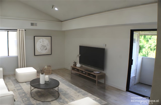 44406 15th St E Unit 13, Lancaster, CA 93535 - living room with healthy amount of natural light, lofted ceiling, and wood finished floors
