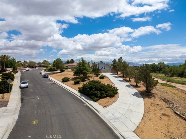 13912 Riverside Dr, Apple Valley, CA 92307 - view of street with curbs and sidewalks