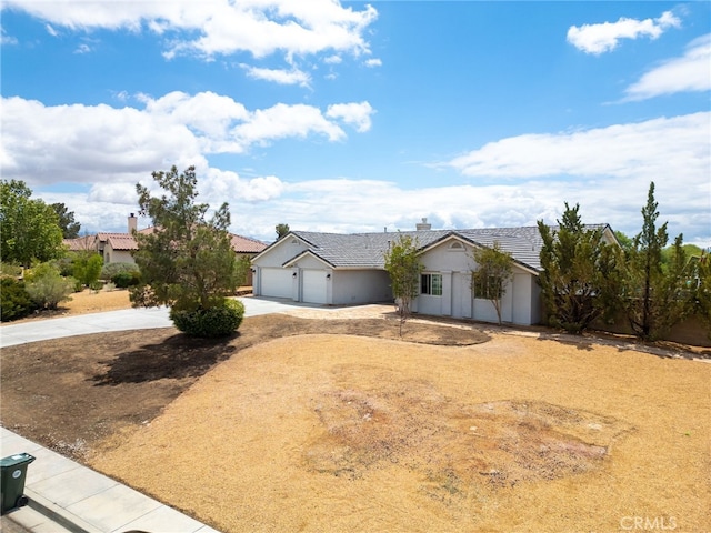 13912 Riverside Dr, Apple Valley, CA 92307 - ranch-style house featuring a garage, stucco siding, a tile roof, a chimney, and concrete driveway