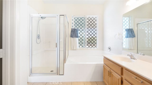 13912 Riverside Dr, Apple Valley, CA 92307 - full bathroom with vanity, a garden tub, a shower stall, and tile patterned flooring