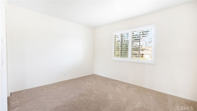 13912 Riverside Dr, Apple Valley, CA 92307 - spare room with carpet flooring and baseboards