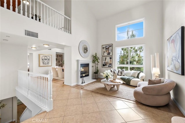 13031 Villosa Pl Unit 437, Playa Vista, CA 90094 - living room with a towering ceiling, baseboards, light tile patterned floors, and visible vents