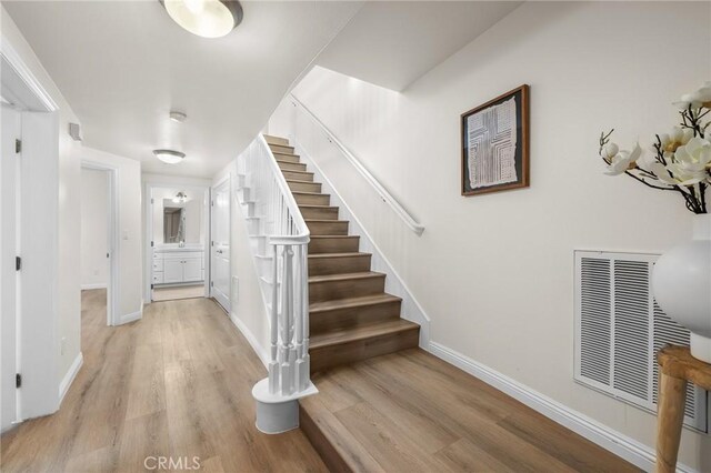 13031 Villosa Pl Unit 437, Playa Vista, CA 90094 - stairs with baseboards, visible vents, and wood finished floors