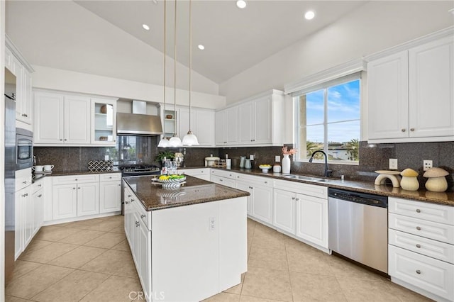 13031 Villosa Pl Unit 437, Playa Vista, CA 90094 - kitchen featuring stainless steel dishwasher, light tile patterned floors, a sink, vaulted ceiling, and wall chimney range hood