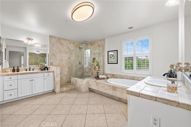13031 Villosa Pl Unit 437, Playa Vista, CA 90094 - bathroom with a sink, tile patterned floors, a walk in shower, two vanities, and a bath