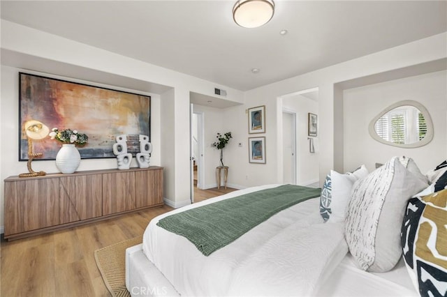 13031 Villosa Pl Unit 437, Playa Vista, CA 90094 - bedroom with light wood-type flooring, baseboards, and visible vents