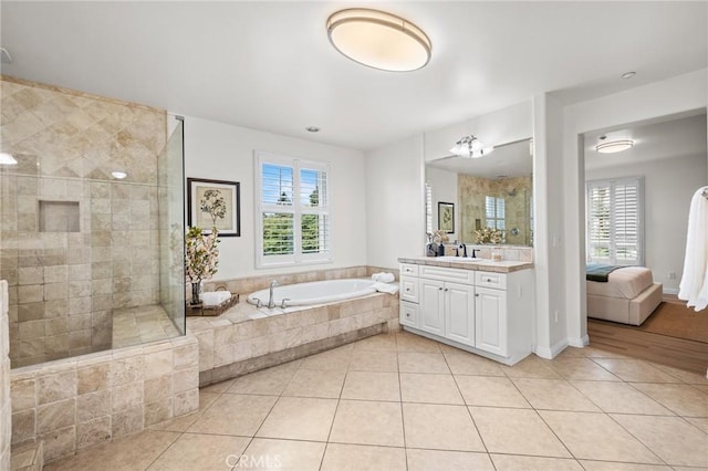 13031 Villosa Pl Unit 437, Playa Vista, CA 90094 - bathroom featuring ensuite bath, a tile shower, tile patterned flooring, a garden tub, and vanity