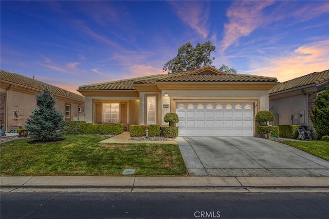 5004 Rolling Hills Ave, Banning, CA 92220 - view of front of property with a yard, a tile roof, an attached garage, and driveway