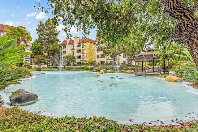 view of swimming pool with a gazebo