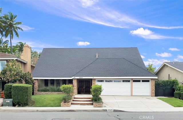 25211 Barents, Laguna Hills, CA 92653 - view of front of property featuring concrete driveway, brick siding, a front yard, and a garage