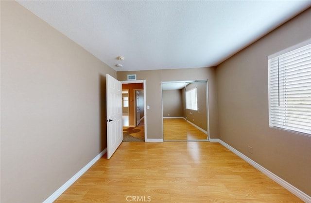 25211 Barents, Laguna Hills, CA 92653 - spare room featuring light wood-type flooring, visible vents, and baseboards