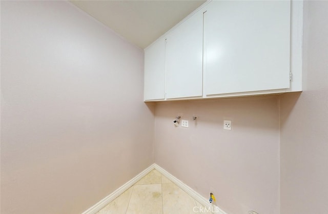 25211 Barents, Laguna Hills, CA 92653 - clothes washing area with baseboards, gas dryer hookup, light tile patterned flooring, and cabinet space