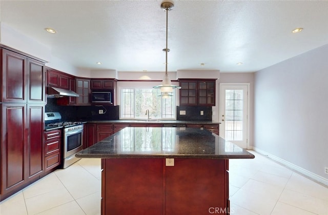 25211 Barents, Laguna Hills, CA 92653 - kitchen featuring under cabinet range hood, a sink, backsplash, reddish brown cabinets, and appliances with stainless steel finishes