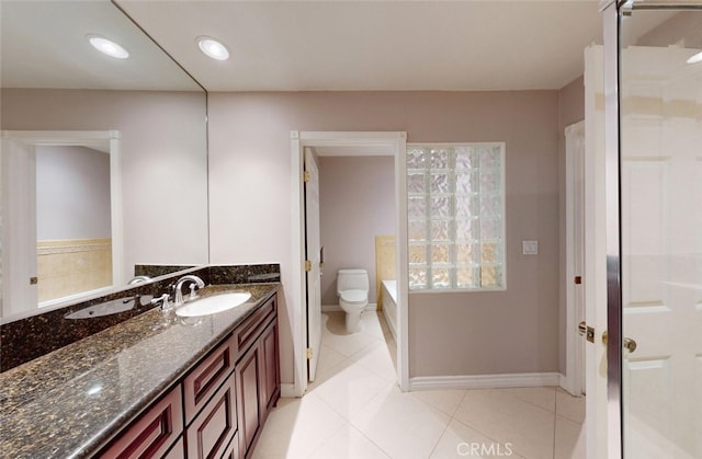 25211 Barents, Laguna Hills, CA 92653 - full bath featuring tile patterned floors, vanity, toilet, baseboards, and a tub