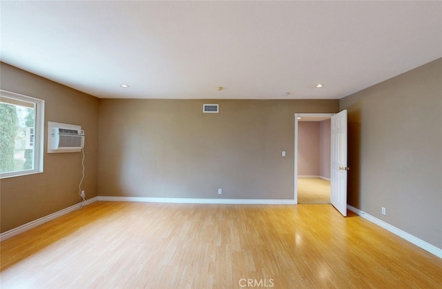 25211 Barents, Laguna Hills, CA 92653 - spare room with light wood-style flooring, recessed lighting, visible vents, baseboards, and an AC wall unit