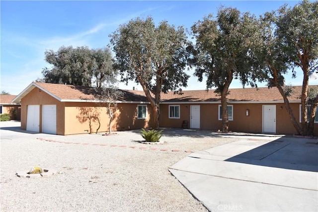 single story home featuring stucco siding