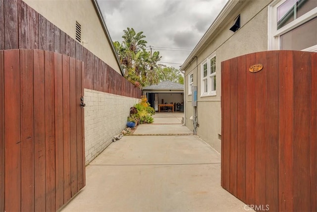 516 S Sparks St S, Burbank, CA 91506 - view of side of home with a patio, stucco siding, and a gate