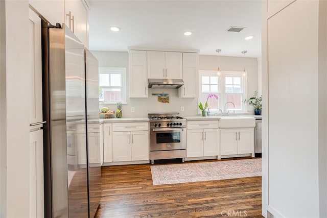 516 S Sparks St S, Burbank, CA 91506 - kitchen featuring dark wood-type flooring, visible vents, under cabinet range hood, light countertops, and appliances with stainless steel finishes