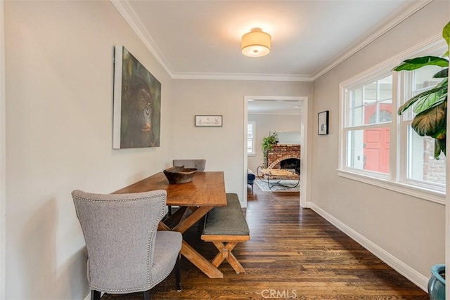 516 S Sparks St S, Burbank, CA 91506 - dining room with crown molding, dark wood finished floors, a fireplace, and baseboards
