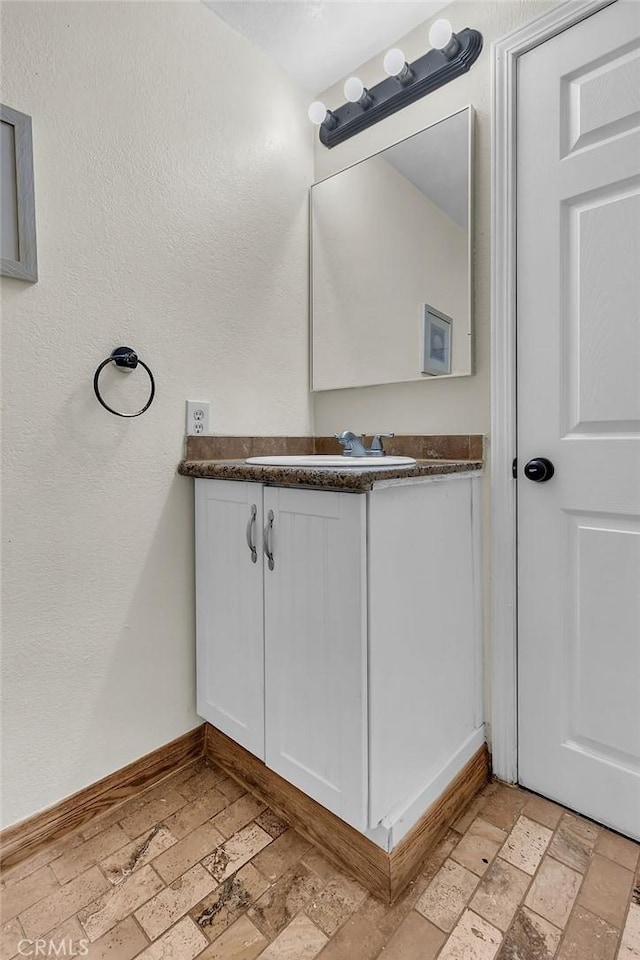 583 Arbula Dr, Crestline, CA 92325 - bathroom featuring vanity and baseboards