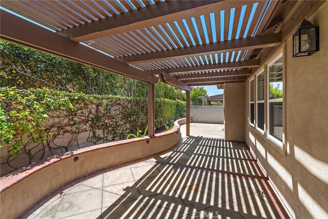 balcony featuring a pergola and a patio area