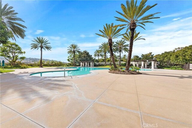 community pool featuring a patio area