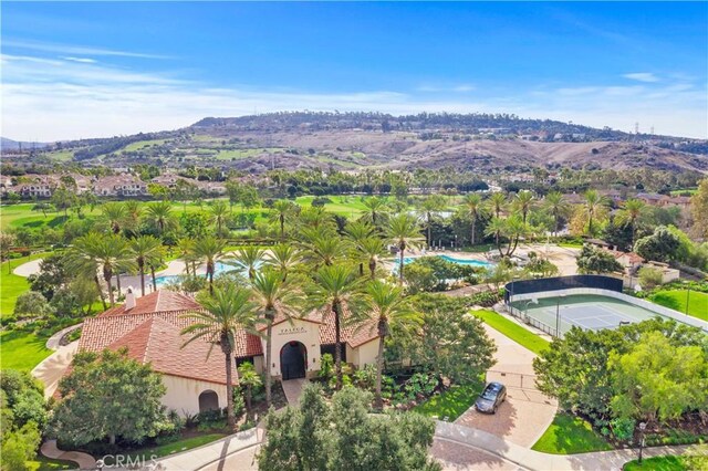 bird's eye view of a pool area and mountains