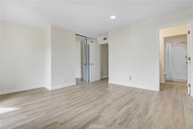 1023 S Citron St Unit 21, Anaheim, CA 92805 - spare room featuring light wood finished floors and baseboards