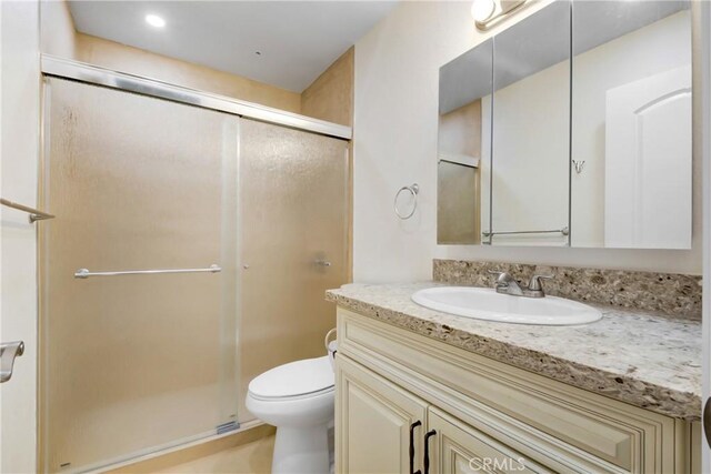 1023 S Citron St Unit 21, Anaheim, CA 92805 - bathroom featuring vanity, a stall shower, and toilet