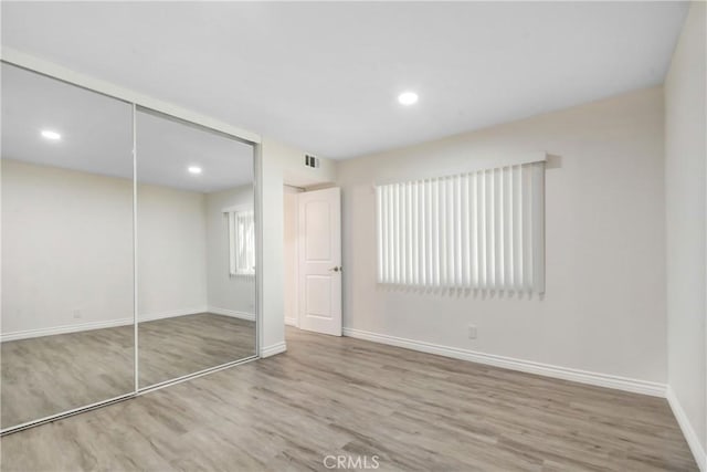 1023 S Citron St Unit 21, Anaheim, CA 92805 - unfurnished bedroom featuring wood finished floors, baseboards, a closet, and recessed lighting