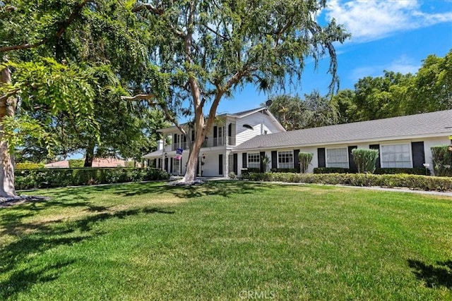 2141 Westminster Dr, Riverside, CA 92506 - traditional-style home featuring a front lawn and a balcony