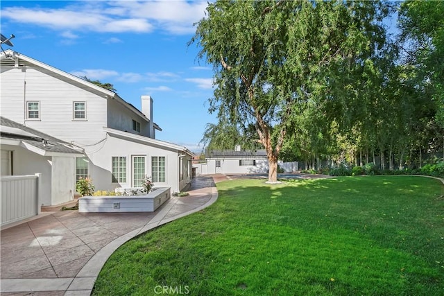 2141 Westminster Dr, Riverside, CA 92506 - view of green lawn with a patio