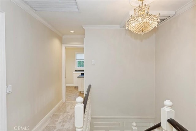 2141 Westminster Dr, Riverside, CA 92506 - corridor with an upstairs landing, a chandelier, ornamental molding, light carpet, and baseboards