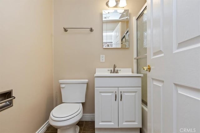 2141 Westminster Dr, Riverside, CA 92506 - full bath with vanity, toilet, baseboards, a shower with shower door, and tile patterned floors