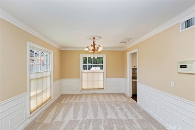 2141 Westminster Dr, Riverside, CA 92506 - unfurnished room featuring a chandelier, wainscoting, ornamental molding, a decorative wall, and light carpet