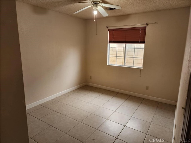 725 18th Pl, Delano, CA 93215 - spare room featuring ceiling fan, a textured ceiling, light tile patterned floors, and visible vents