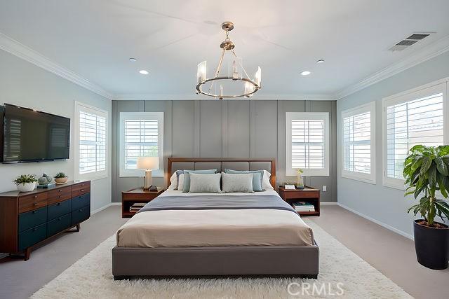 24189 Darmera Dr, Lake Elsinore, CA 92532 - carpeted bedroom with crown molding, multiple windows, a chandelier, baseboards, and recessed lighting