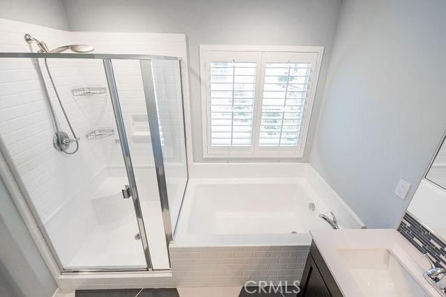 24189 Darmera Dr, Lake Elsinore, CA 92532 - full bath with a garden tub, a shower stall, and vanity