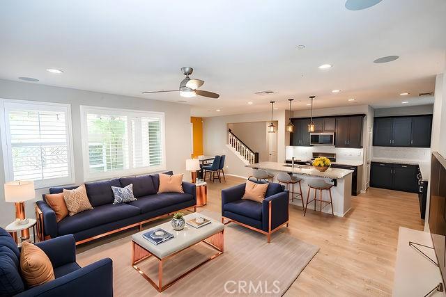 24189 Darmera Dr, Lake Elsinore, CA 92532 - living area with stairs, light wood-style floors, ceiling fan, and recessed lighting
