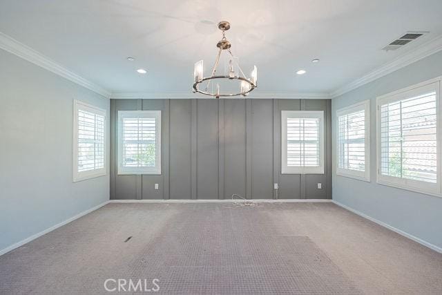 24189 Darmera Dr, Lake Elsinore, CA 92532 - carpeted empty room with crown molding, a chandelier, baseboards, and recessed lighting