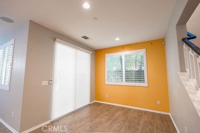24189 Darmera Dr, Lake Elsinore, CA 92532 - empty room featuring wood finished floors, recessed lighting, and baseboards