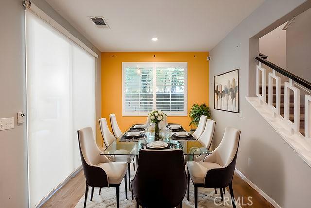 24189 Darmera Dr, Lake Elsinore, CA 92532 - dining room with wood finished floors, baseboards, and recessed lighting