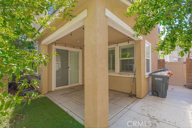 24189 Darmera Dr, Lake Elsinore, CA 92532 - back of house featuring a patio area, stucco siding, and fence