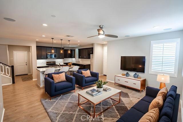 24189 Darmera Dr, Lake Elsinore, CA 92532 - living room featuring a ceiling fan, light wood-type flooring, baseboards, and recessed lighting