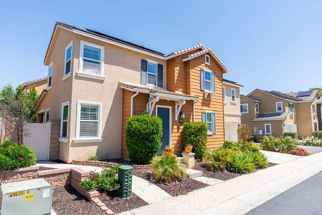 24189 Darmera Dr, Lake Elsinore, CA 92532 - traditional-style home featuring fence, stucco siding, and a residential view