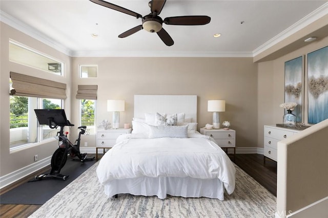 bedroom with wood finished floors, recessed lighting, crown molding, ceiling fan, and baseboards