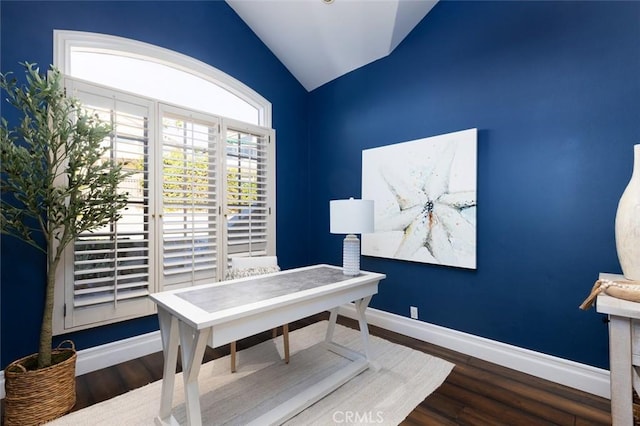office space with baseboards, wood finished floors, and lofted ceiling
