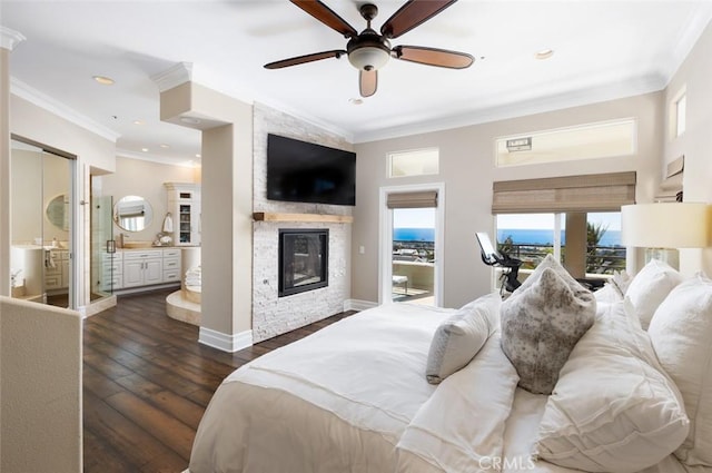 bedroom with a fireplace, crown molding, multiple windows, and dark wood finished floors